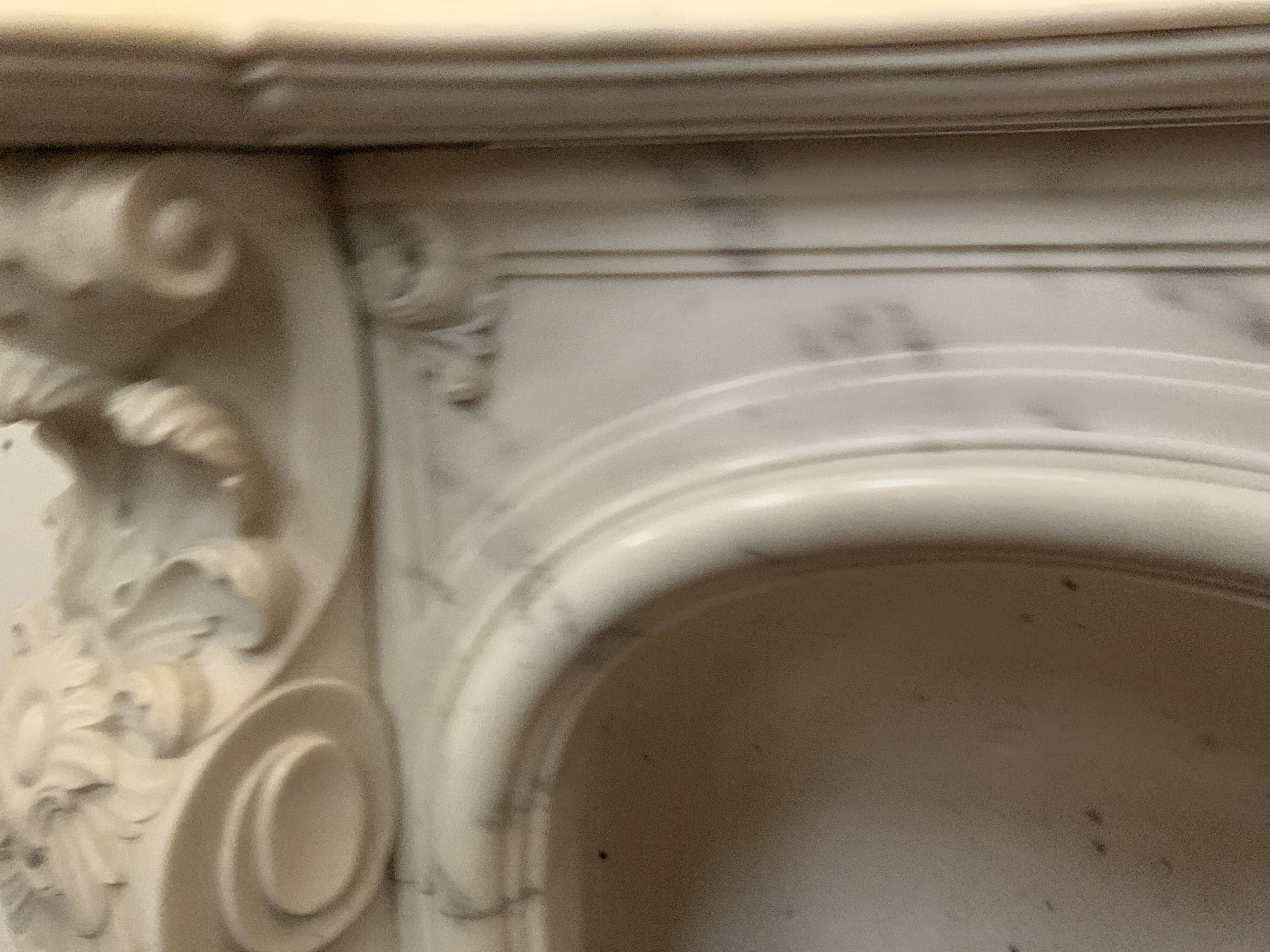 Louis XV style fireplace in white Carrara marble, 19th century