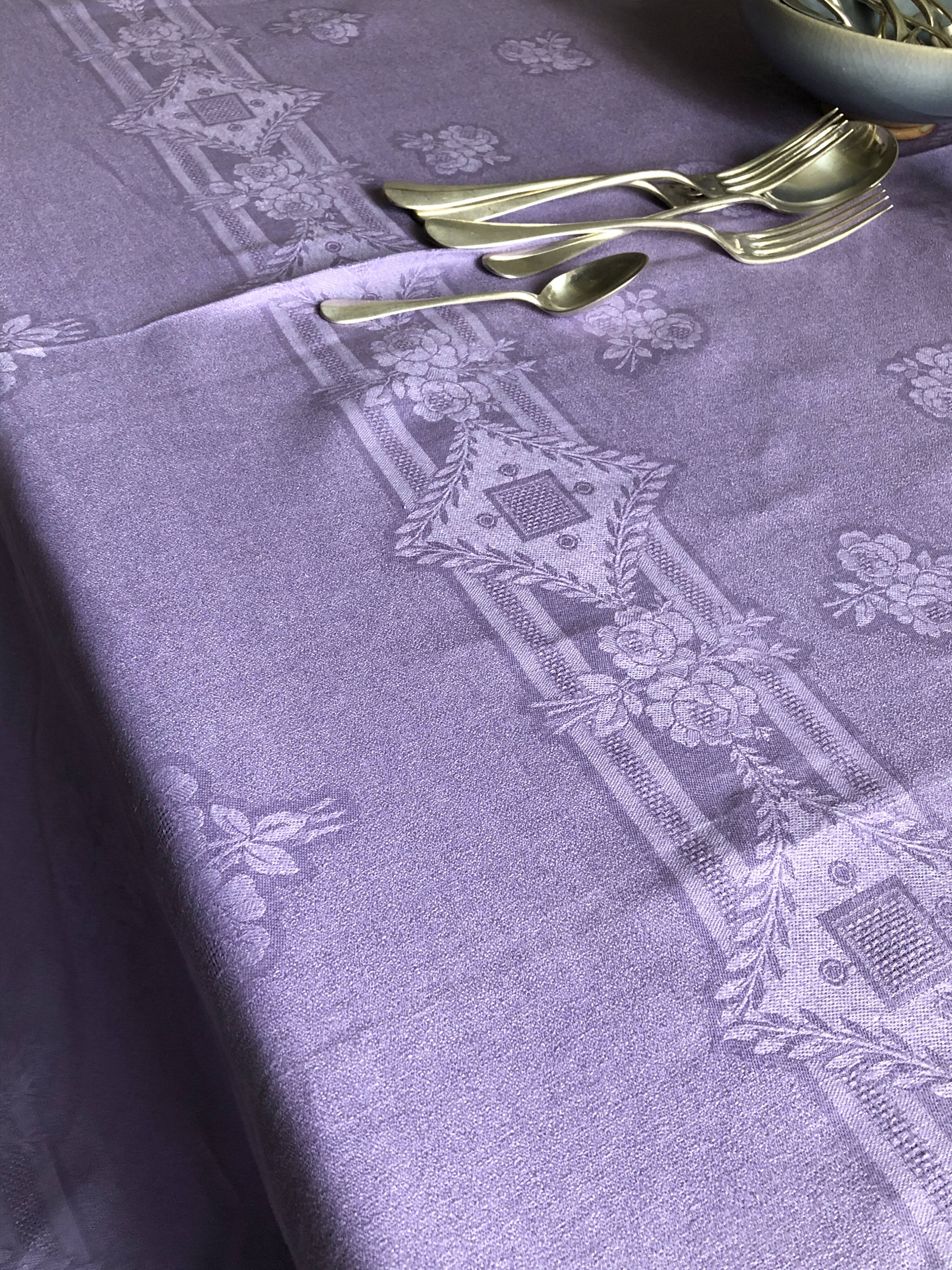 Old damask tablecloth in linen and purple silk
