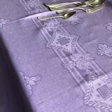 Old damask tablecloth in linen and purple silk