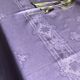 Old damask tablecloth in linen and purple silk