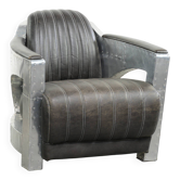 Fauteuil aviateur en cuir de vachette, fini avec de l'aluminium et des rivets.
