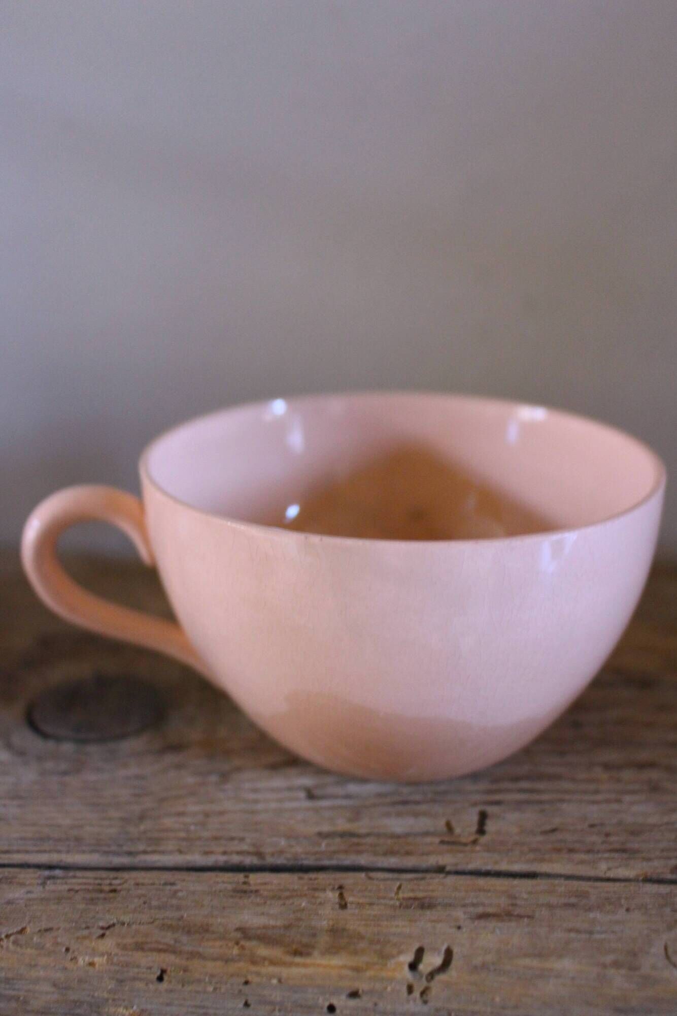 A set of two Digoin Sarreguemines Marylou Rose Art Deco cups.