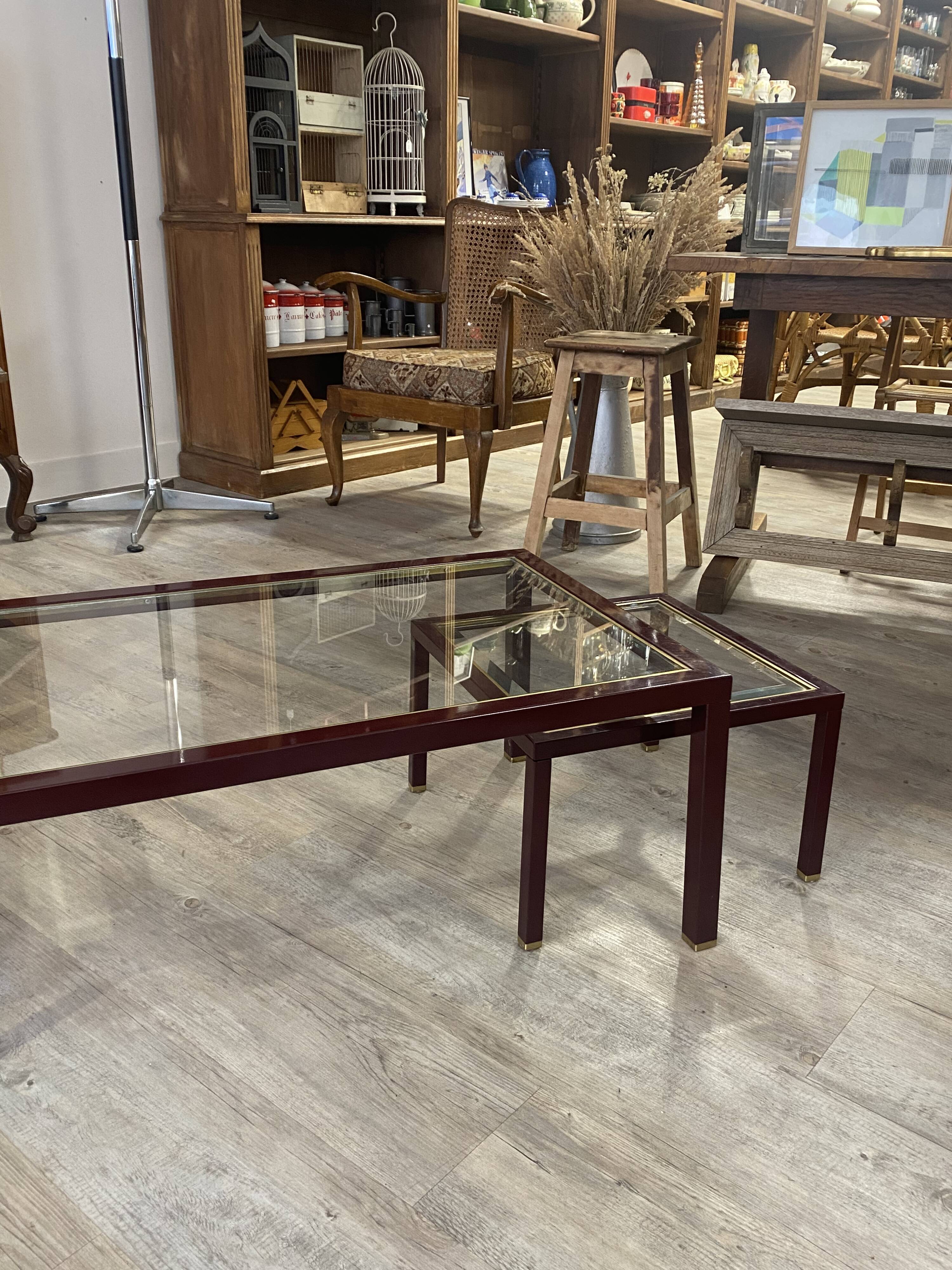 Burgundy lacquered metal, brass and beveled glass nesting tables, France 1950s