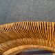 Vintage armchair in straw and brutalist wood