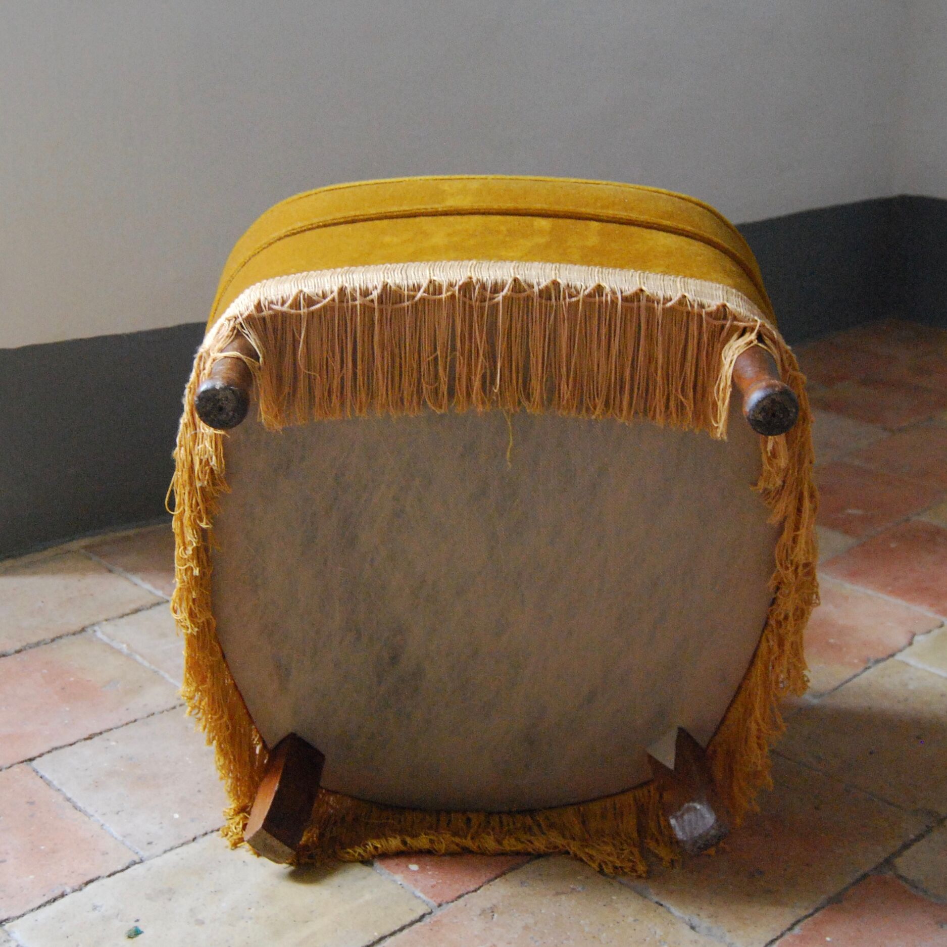 Toad in yellow velvet armchair