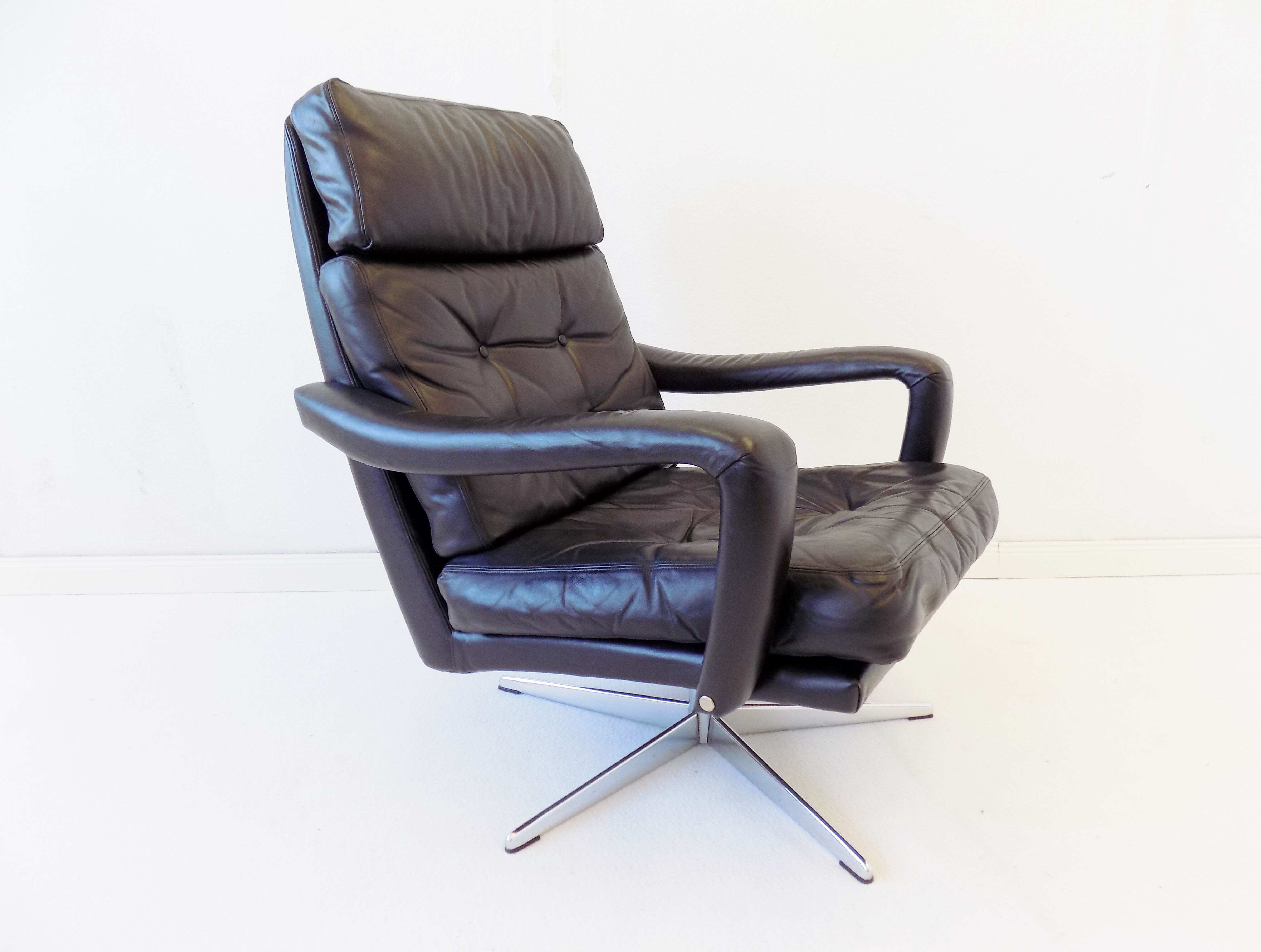 Danish black leather armchair with ottoman 70s