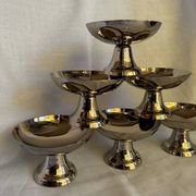 Set of 6 stainless steel ice cream bowls by Guy Degrenne with matching spoons.