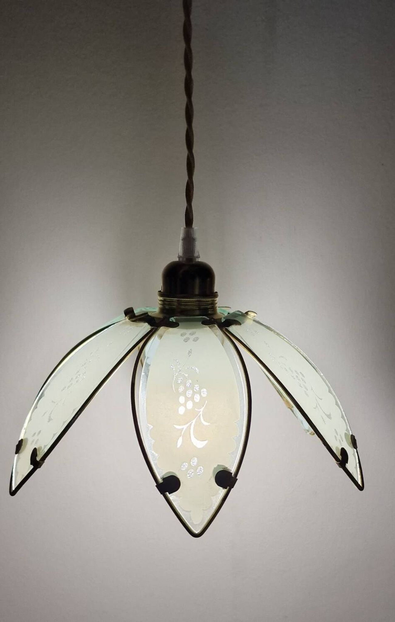 Glass flower rimmed with brass