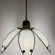 Glass flower rimmed with brass
