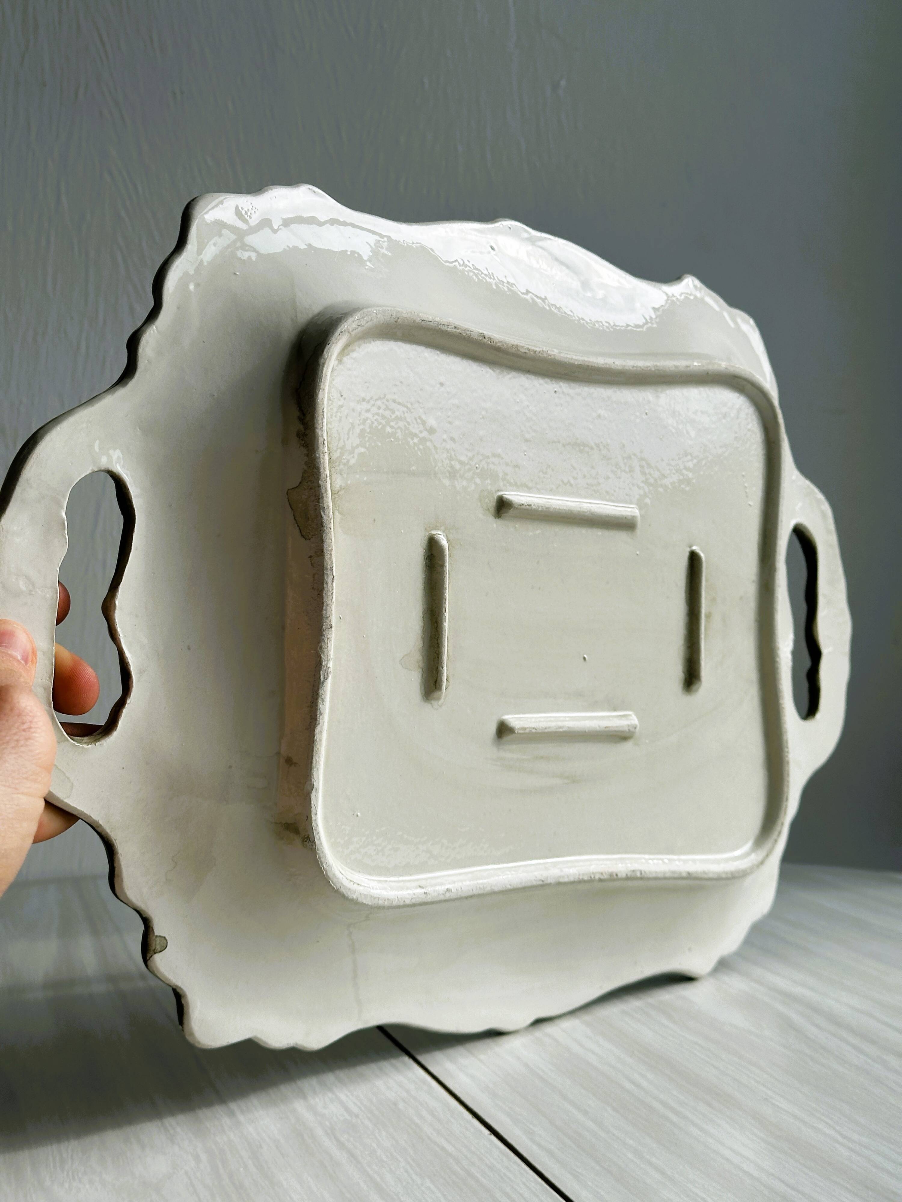 Old white ceramic tray, old dish.