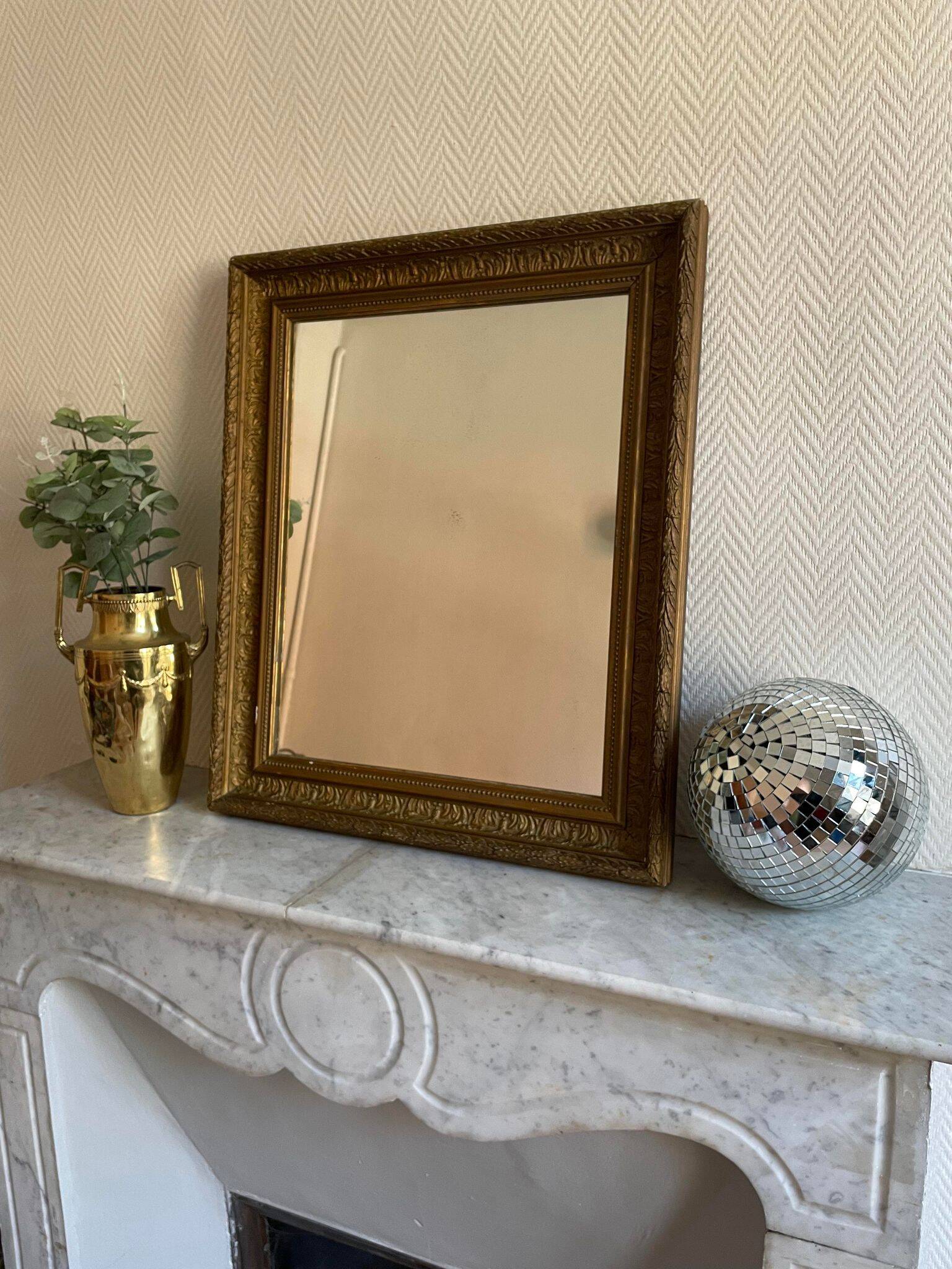 Old mirror with golden wooden frame