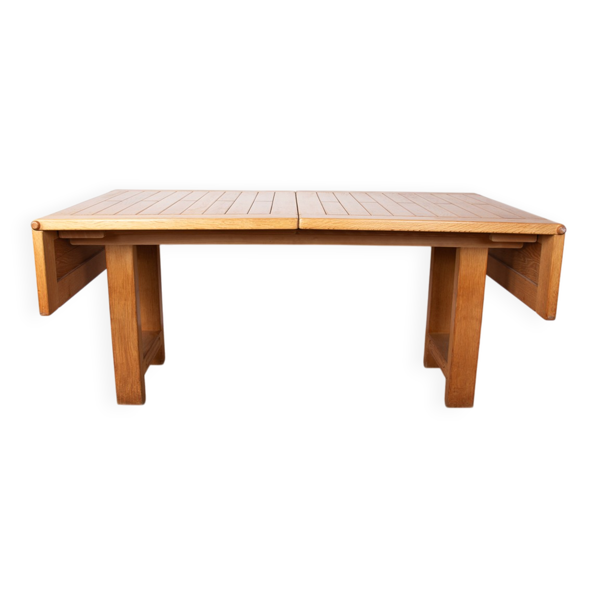 Large extendable dining table in solid oak by Guillerme and Chambron.