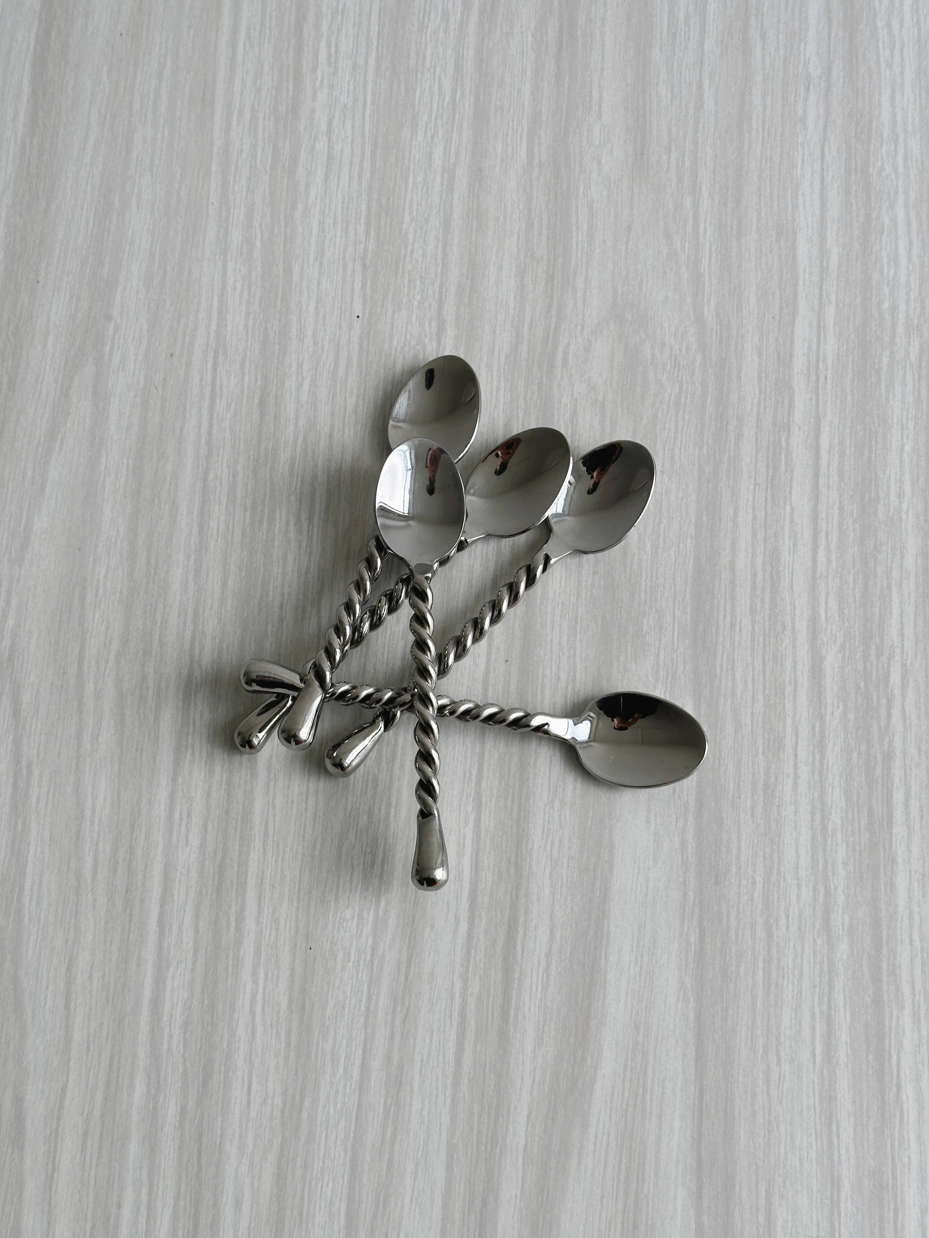 5 small twisted silver metal teaspoons
