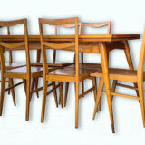 Table with extensions and vintage chairs
