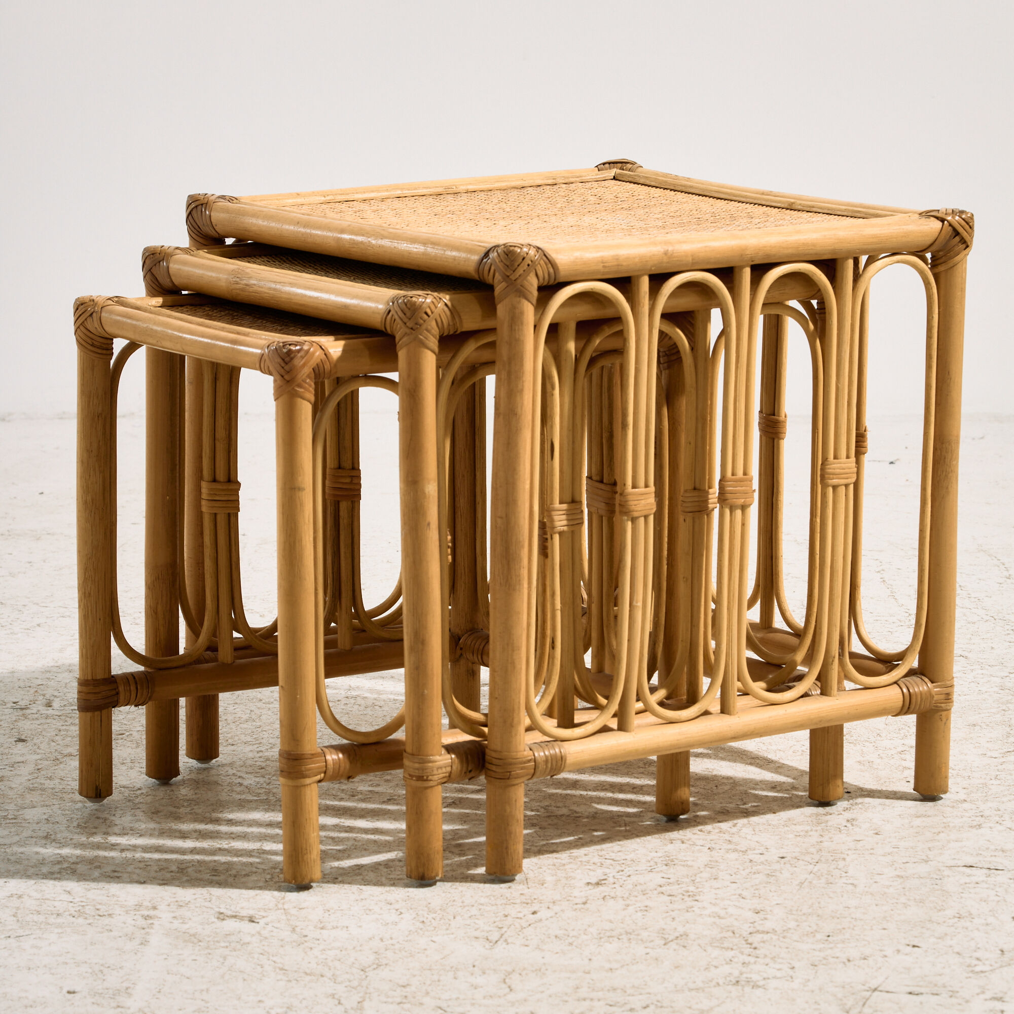 Nest of bamboo and rattan tables, set of 3.