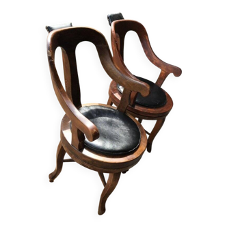 Pair of antique brown swivel armchairs in upholstery fabric, wooden frame, Hungary circa 1900.