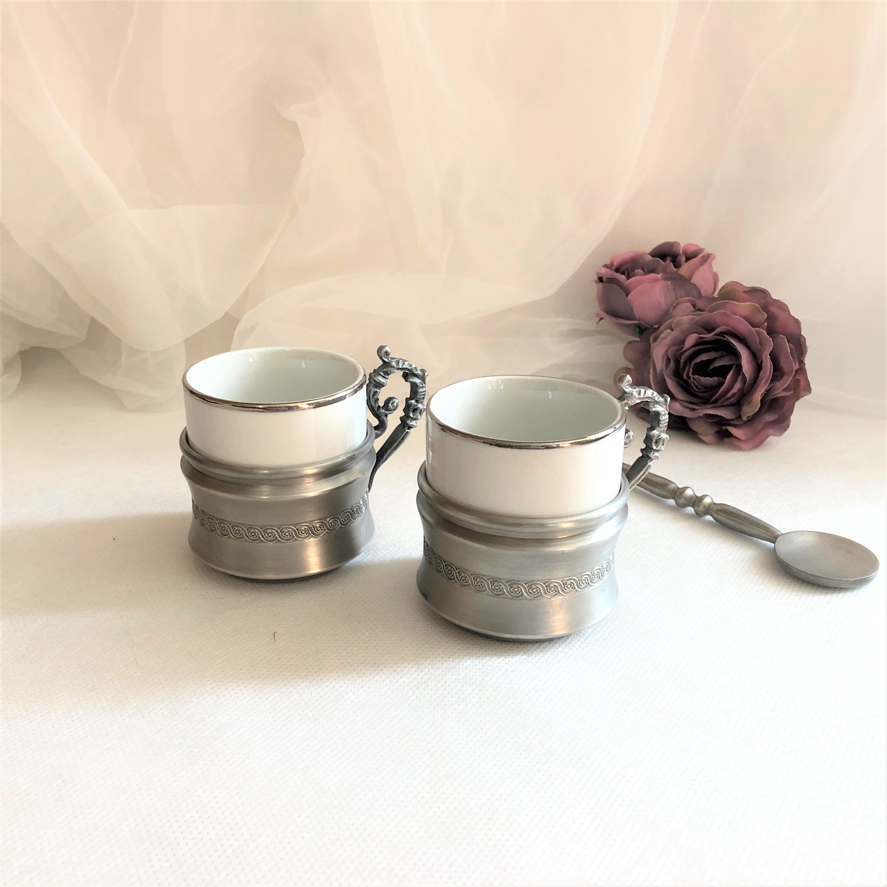 Set two porcelain cups with pewter support