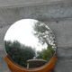 Round mirror on 60's furniture