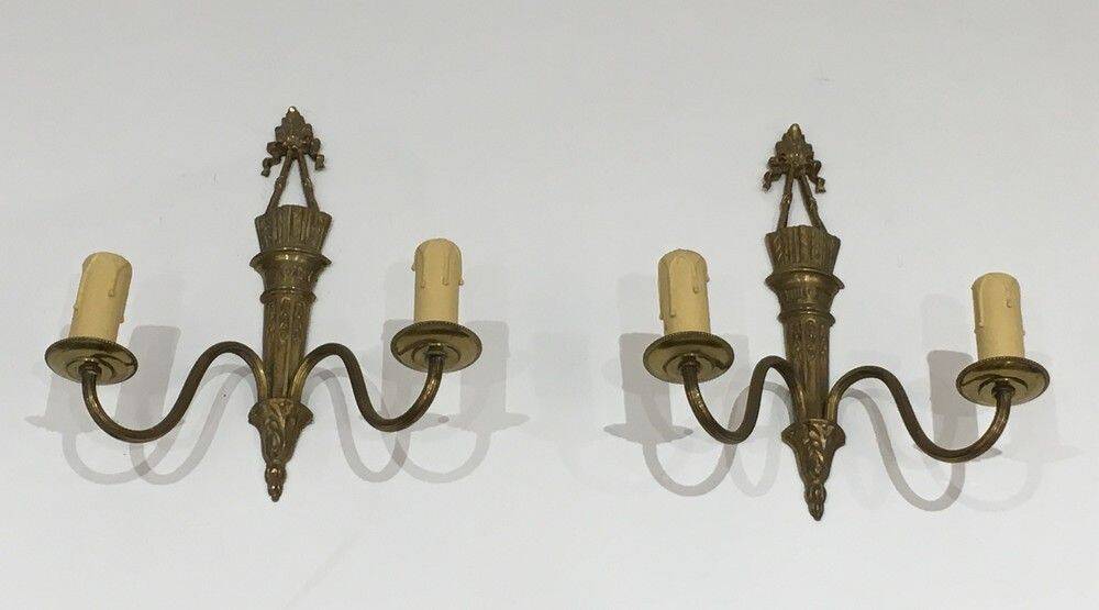 Pair of Louis XVI style bronze wall sconces with quivers and ribbons