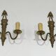 Pair of Louis XVI style bronze wall sconces with quivers and ribbons