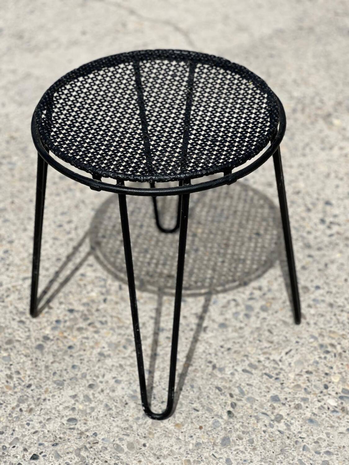 Perforated metal stool