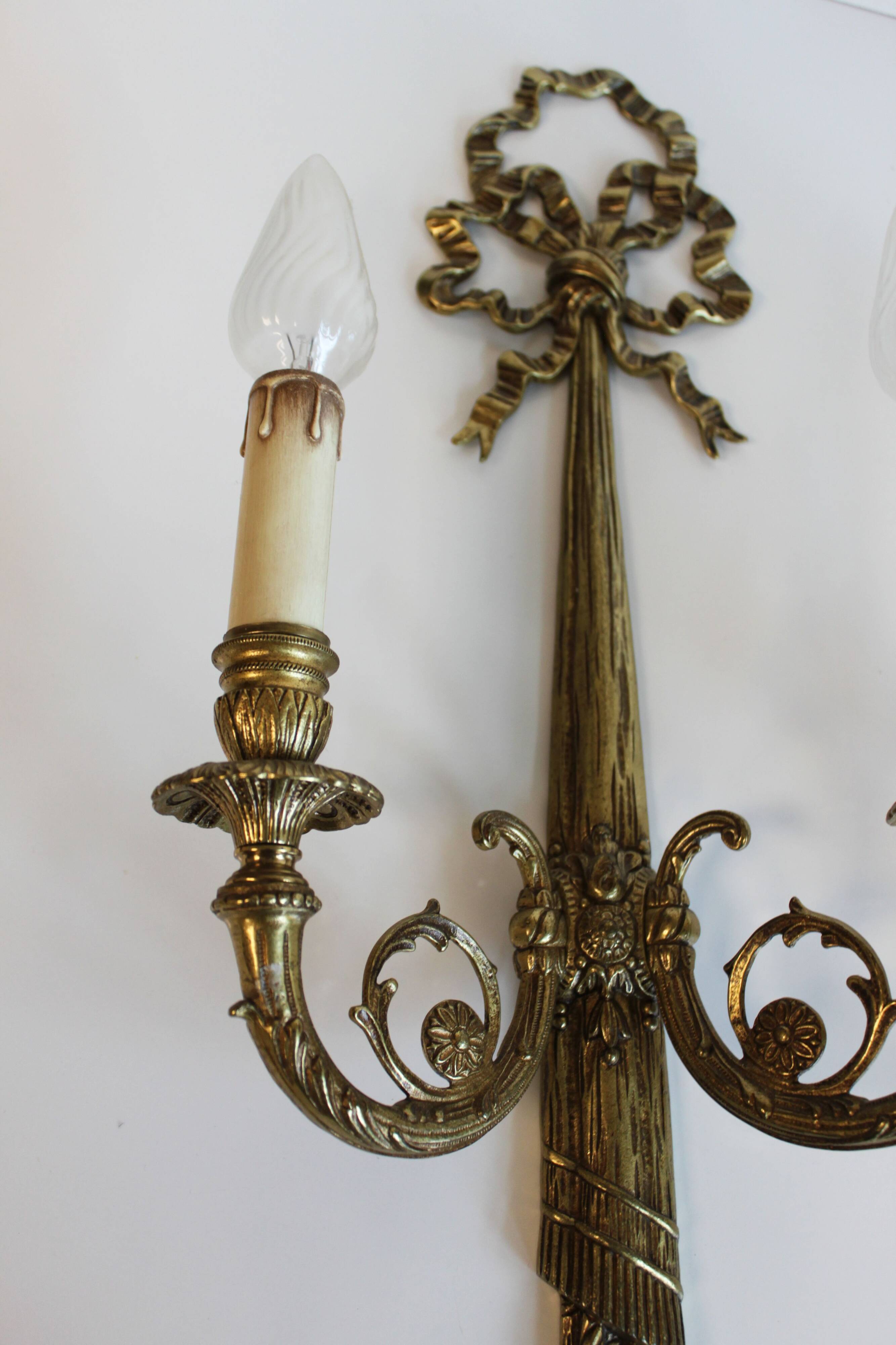 Pair of wall sconces in gilded bronze, Louis XVI style.