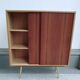 decorative midcentury cabinet with brass legs