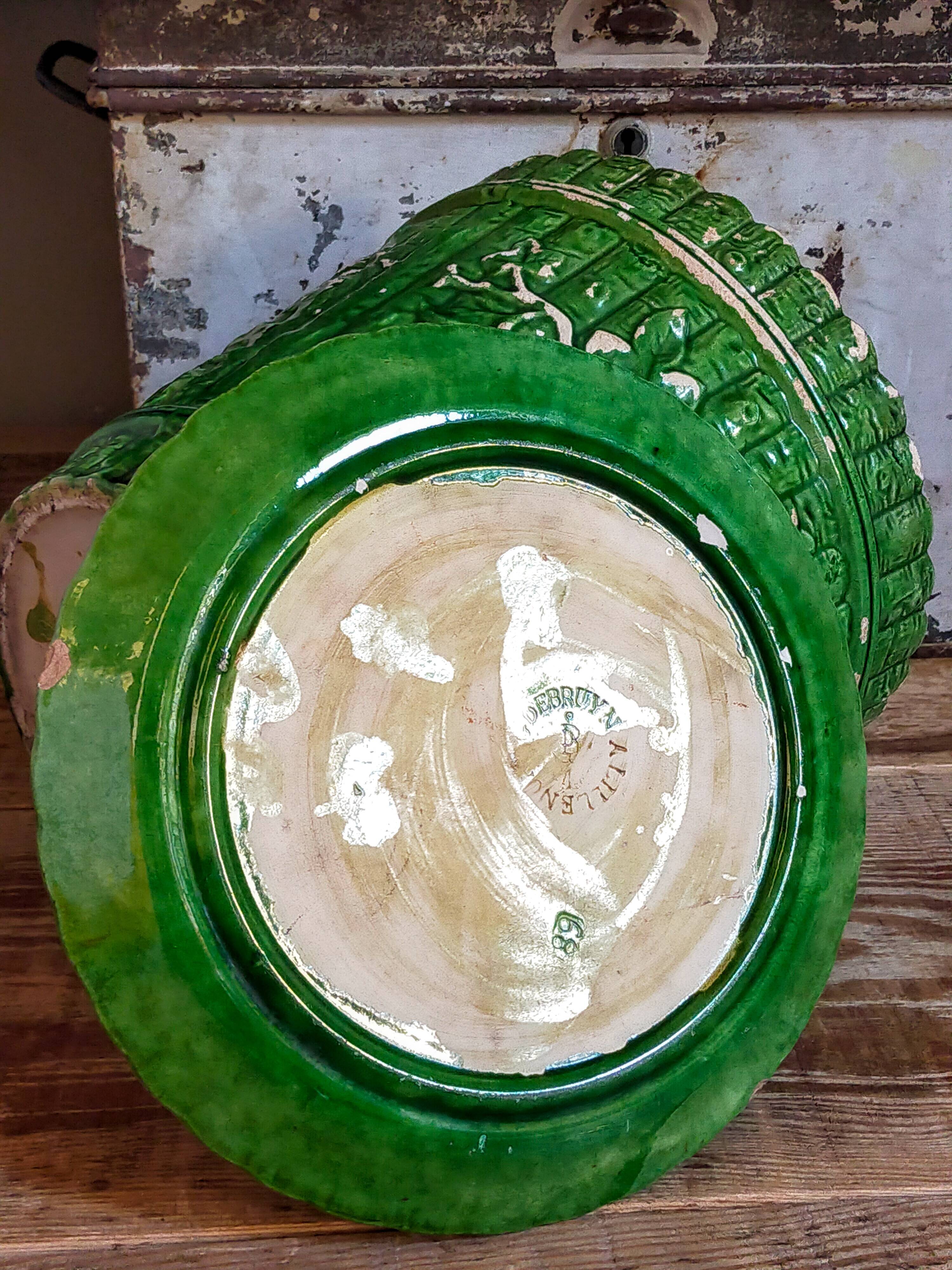 Flower pot and saucer in slip by G. De Bruyn 19th century