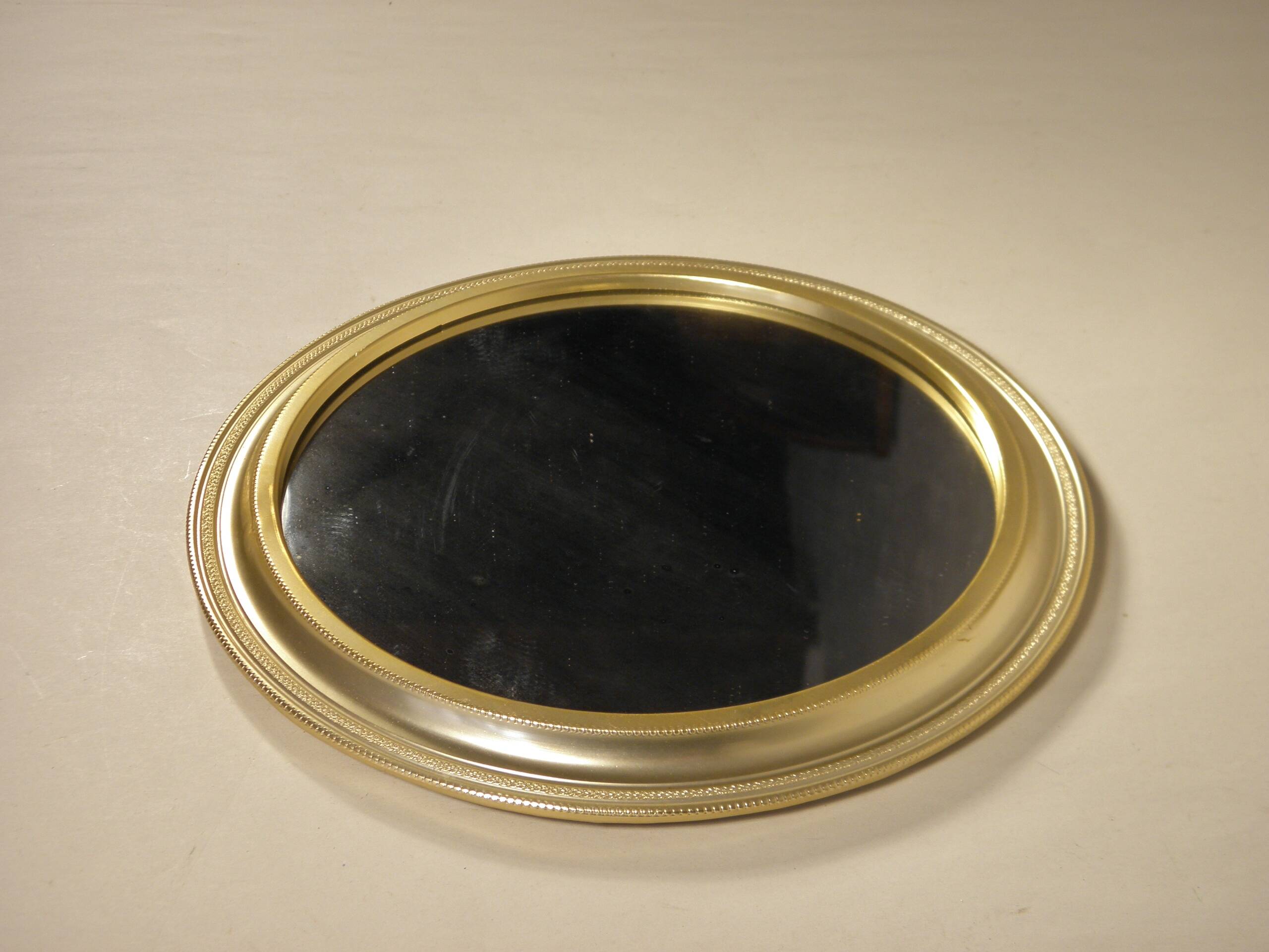 Round mirror in gilded metal 24 cm