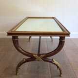 Coffee table in patinated and gilded carved wood with mirror top