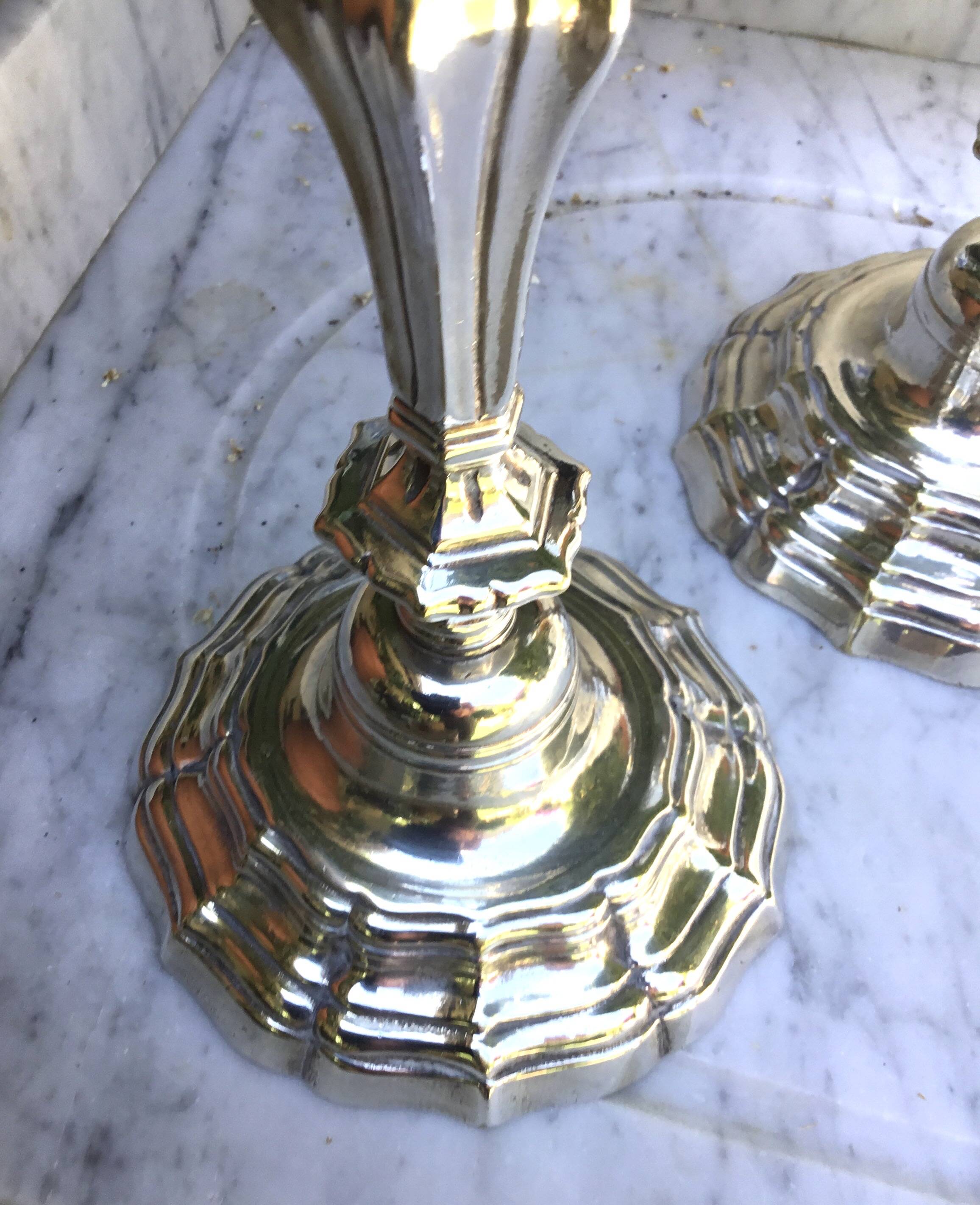 Pair of silvered metal candlesticks in the Louis XIV style.