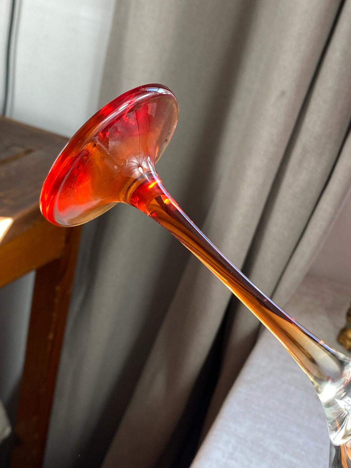 Champagne coupes in glass, multicoloured stems.