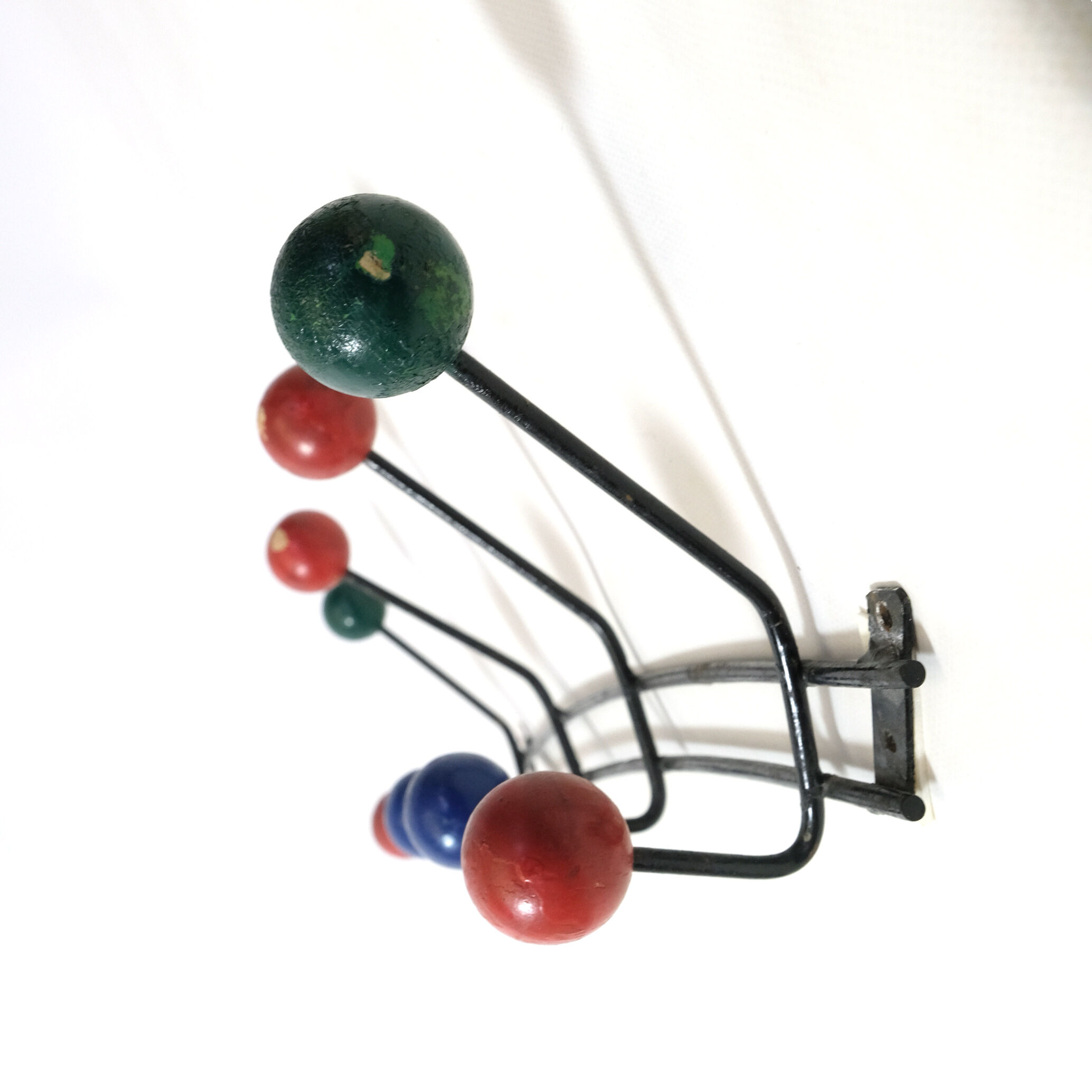 Multicolored wooden and metal coat holder
