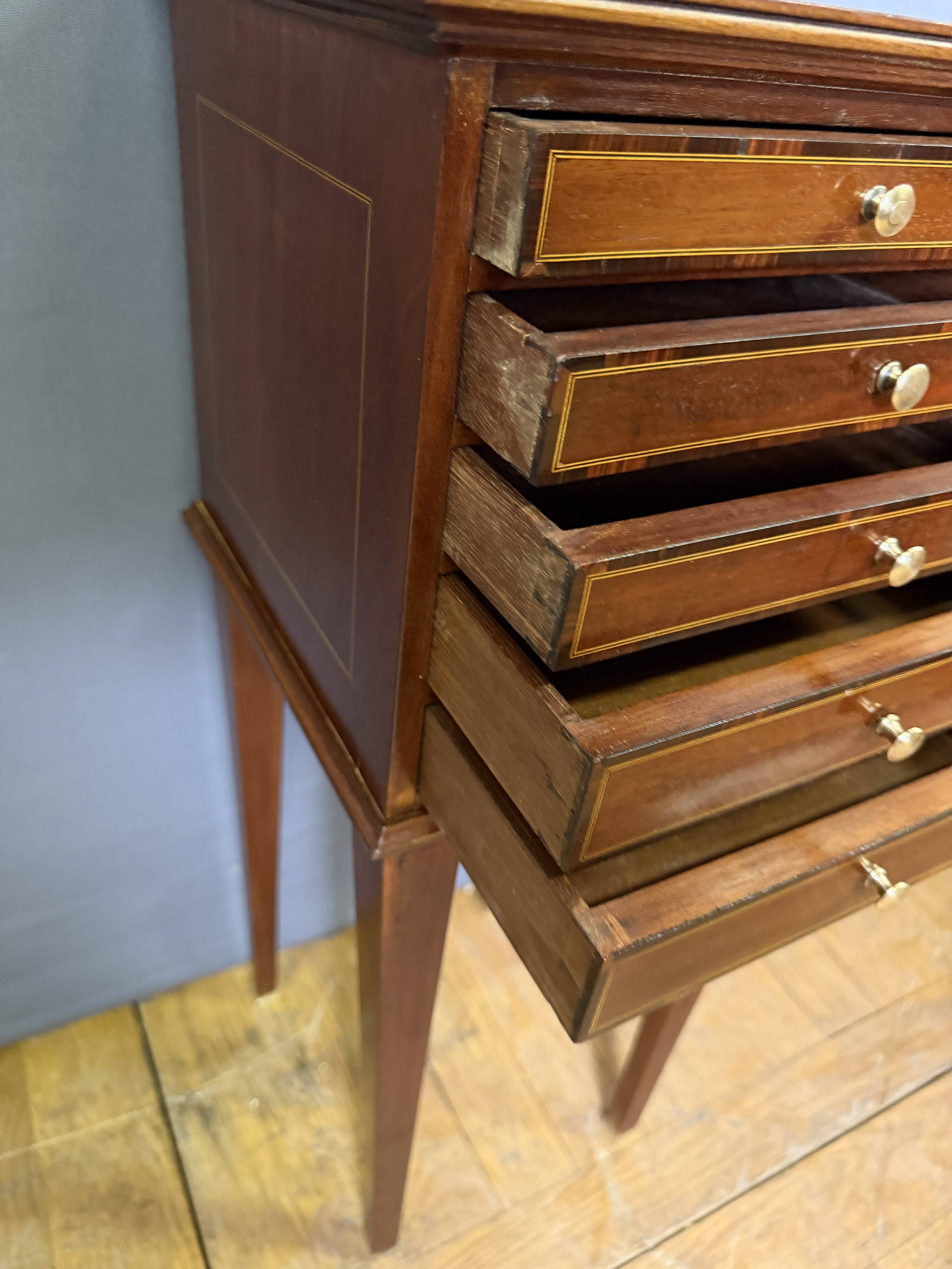 Louis XVI bedside table in mahogany with five drawers.