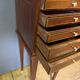 Louis XVI bedside table in mahogany with five drawers.