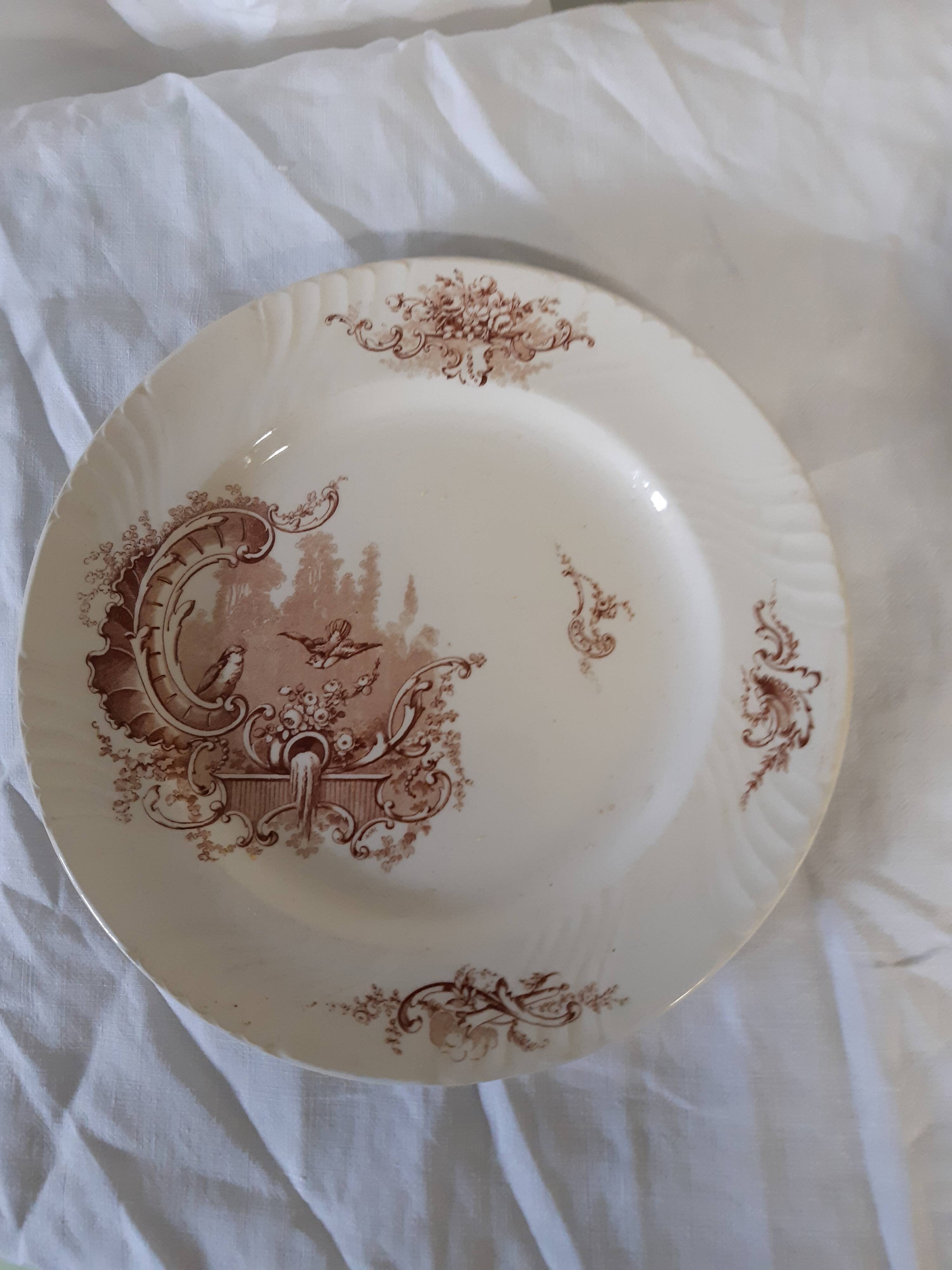10 assiettes en faïence de Lunéville