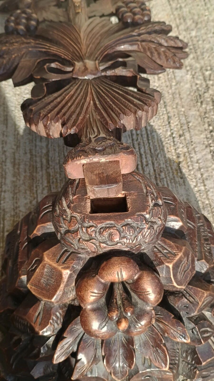 Antique wooden crucifix carved from the Black Forest with grapes and leaves.