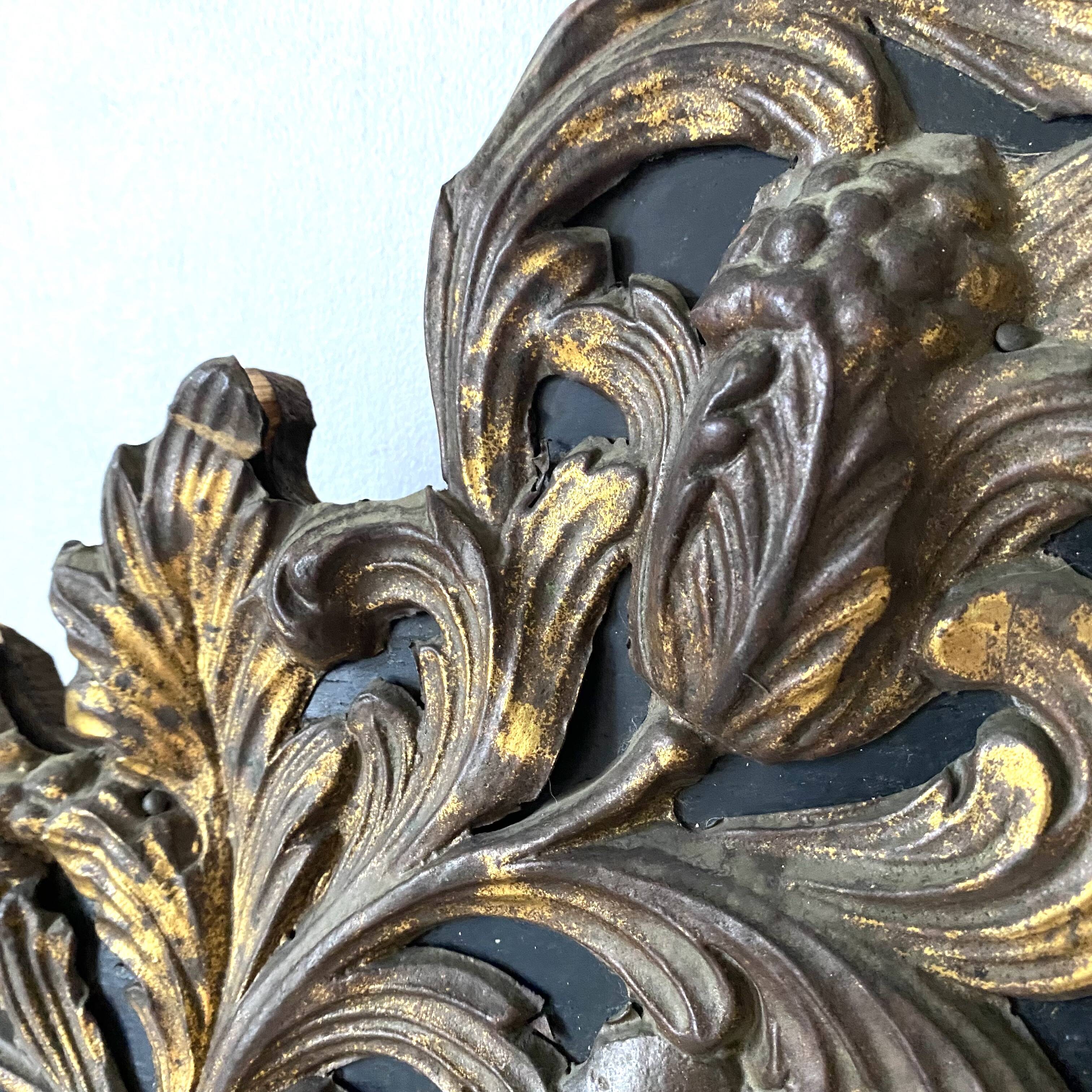 Pediment in blackened wood and 19th century embossed gilded metal foil