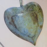 Greenish metal leaf pocket emptier