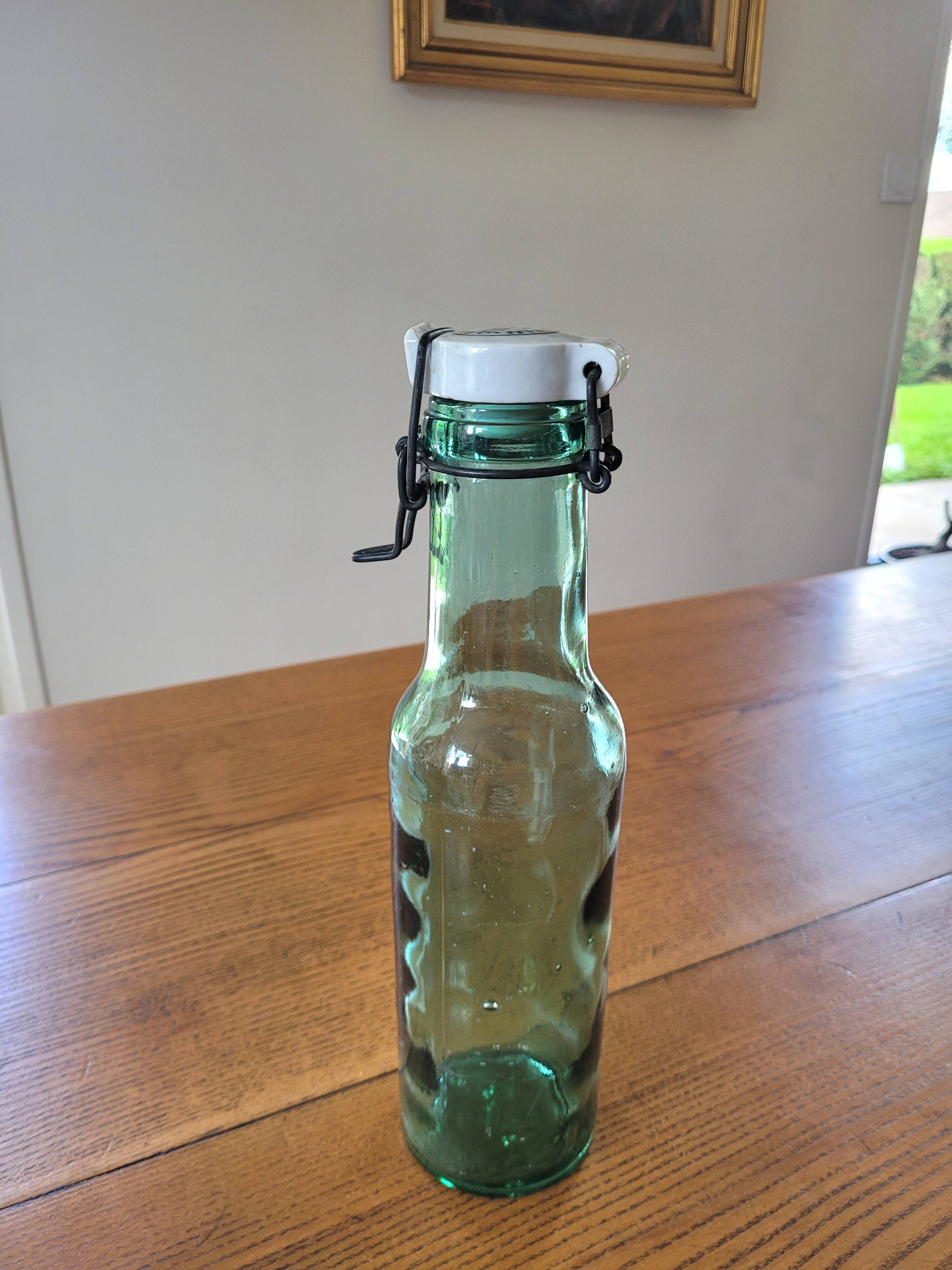 Vintage glass bottle l'Idéale with porcelain stopper