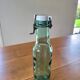 Vintage glass bottle l'Idéale with porcelain stopper