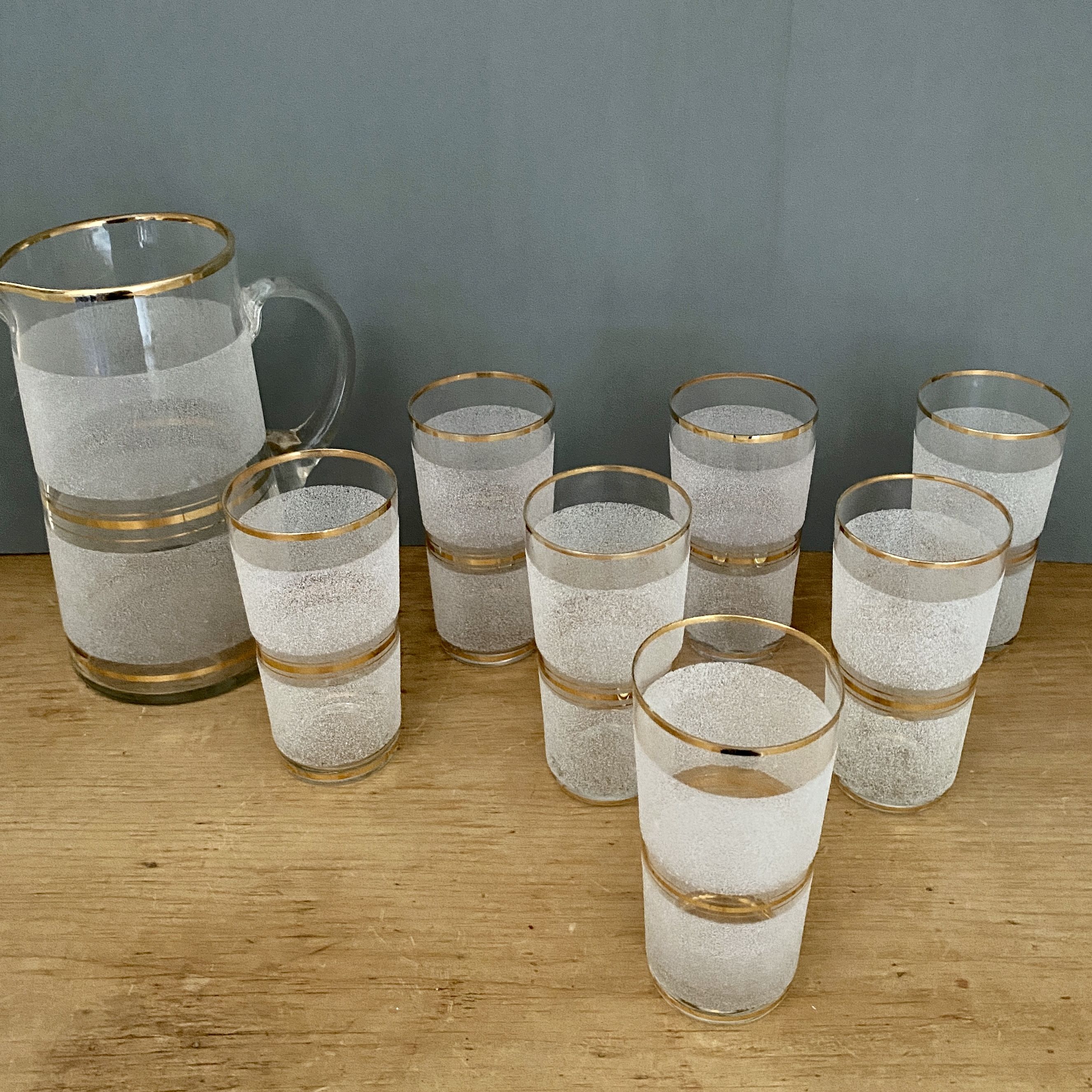 Vintage orangeade service in white granite glass and golden edging