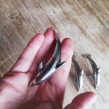 Set of three silver metal dolphin place markers