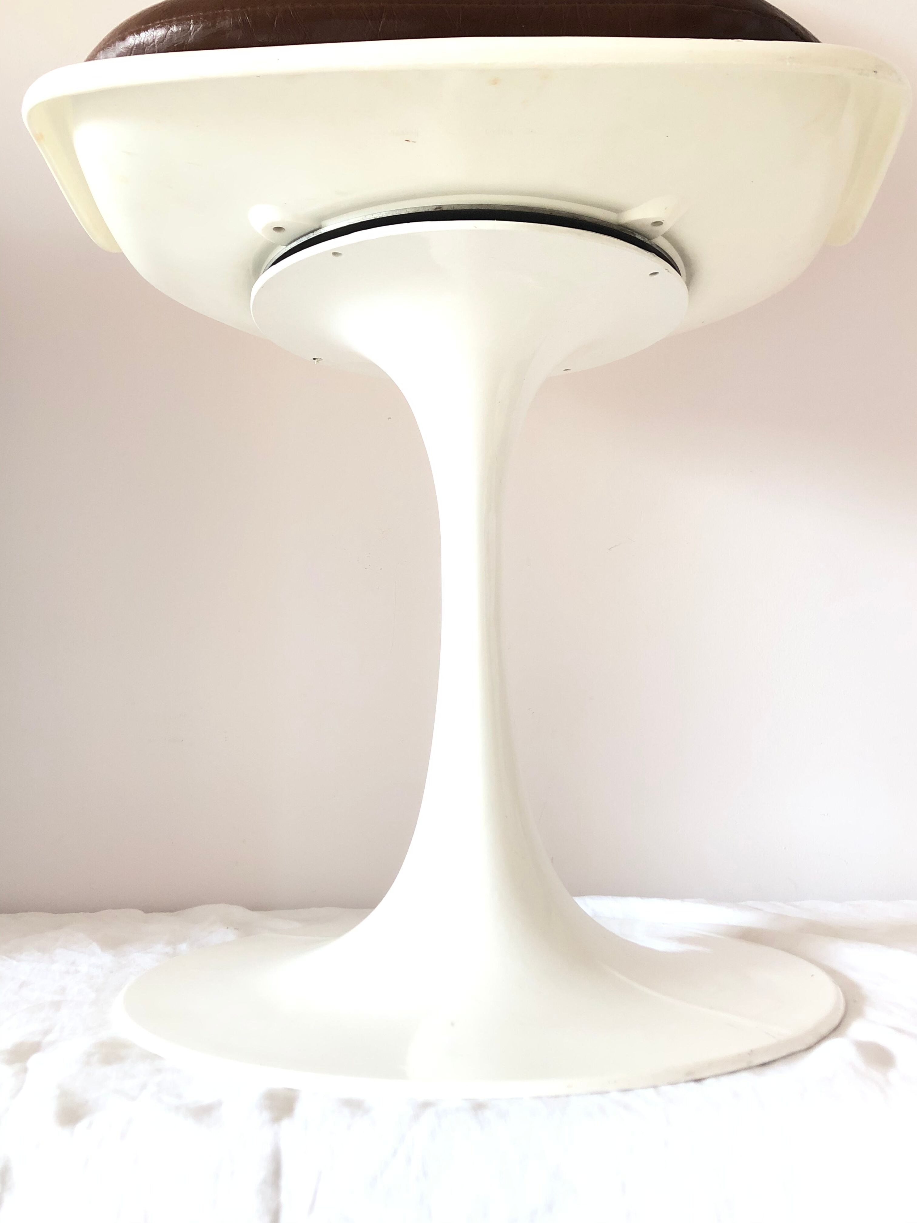 Pair of vintage tulip foot swivel chairs