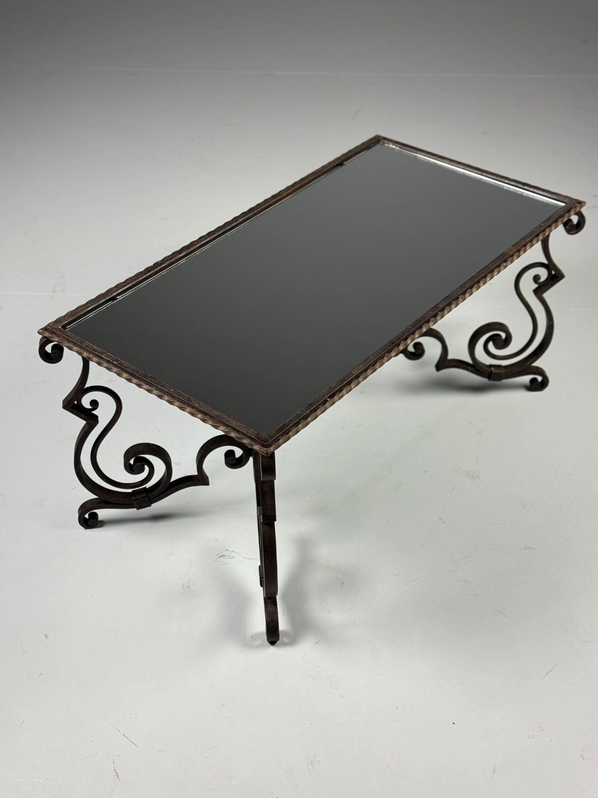Wrought iron coffee table with mirror glass