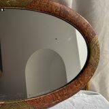 Small oval Art Deco mirror in brown and gold 33x54.
