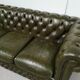 Three-seater green leather Chesterfield sofa