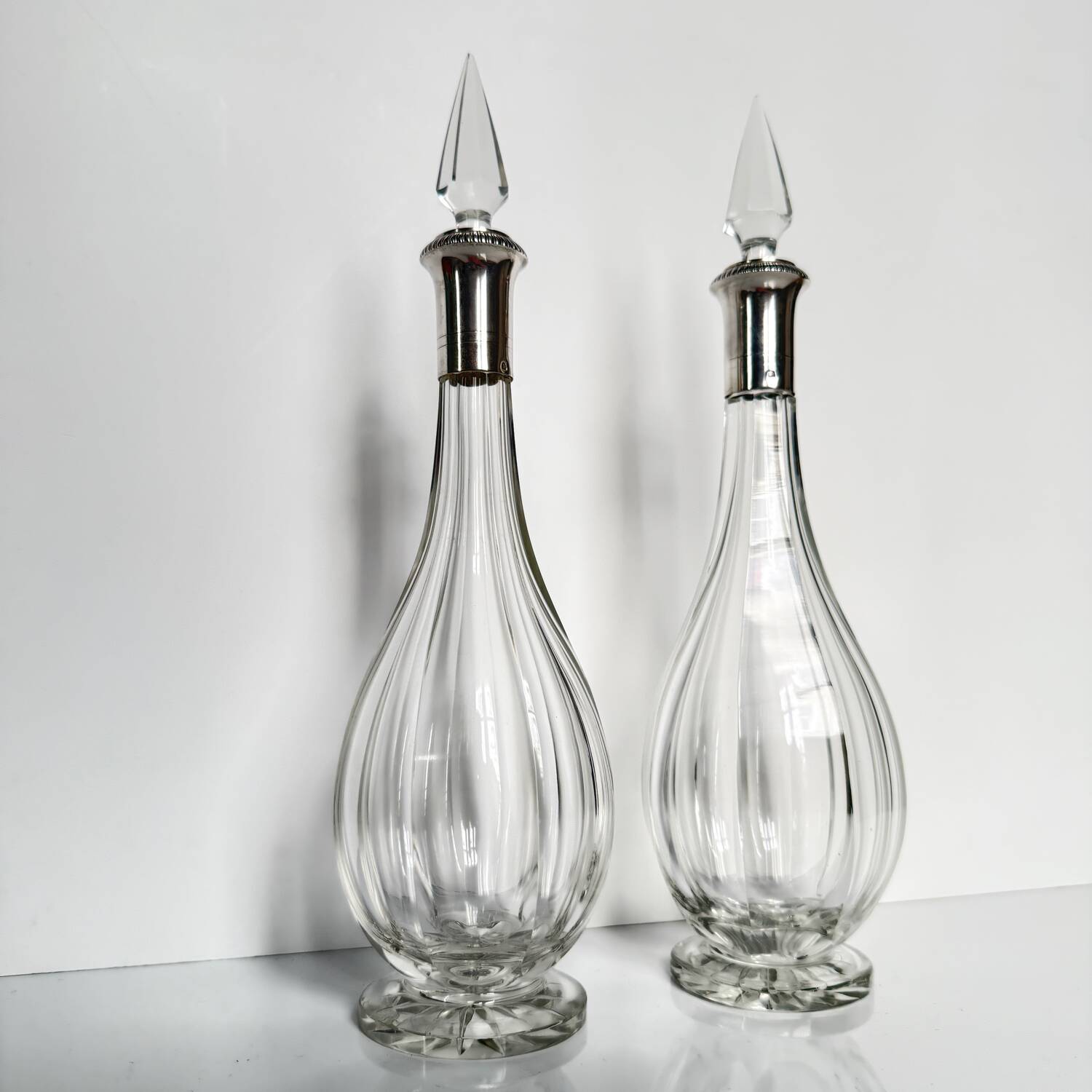 Pair of crystal decanters with solid silver mounts