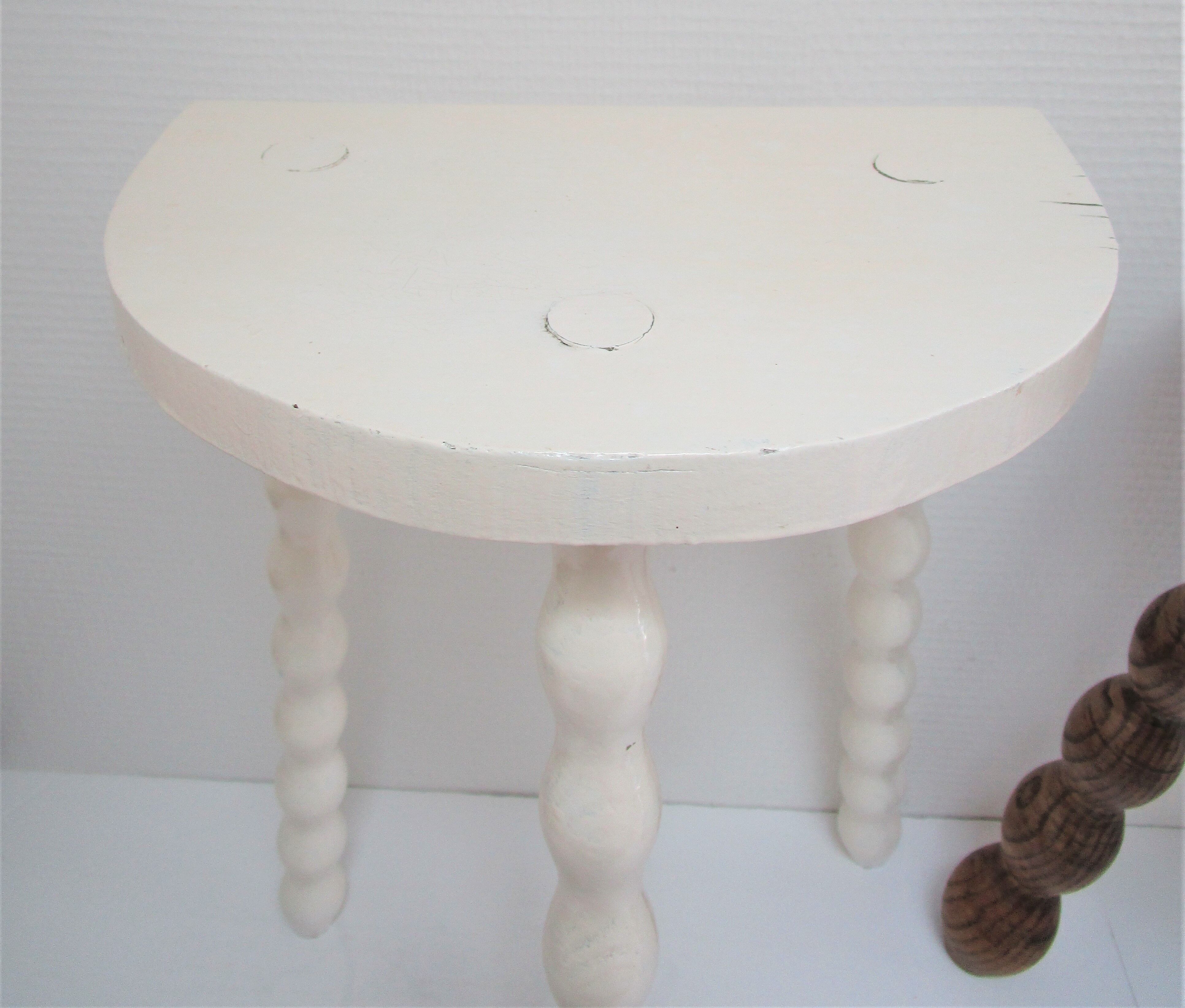 Two vintage tripod solid wood stools