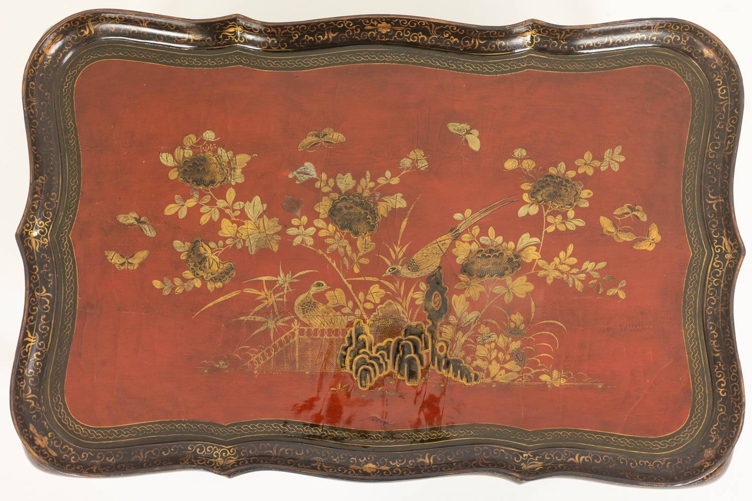 Coffee table with removable top in red and black lacquered wood. 1950s.